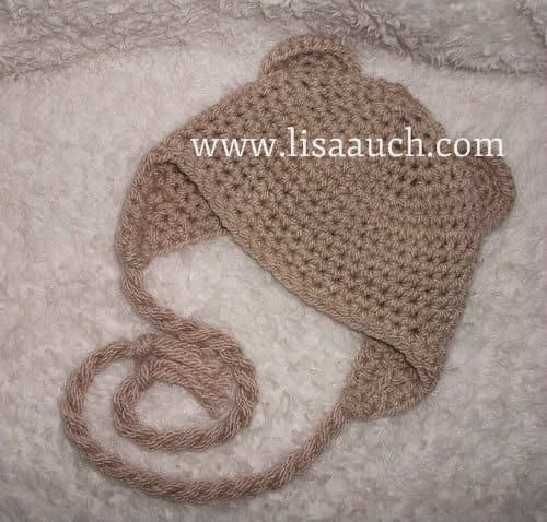 Fabriquez un chapeau pour bébé animal avec des oreilles et des oreillettes pour garder bébé au chaud.